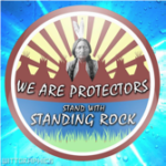 Standing Rock protest badge with Native American image.