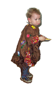 Young girl wearing a brown poncho.